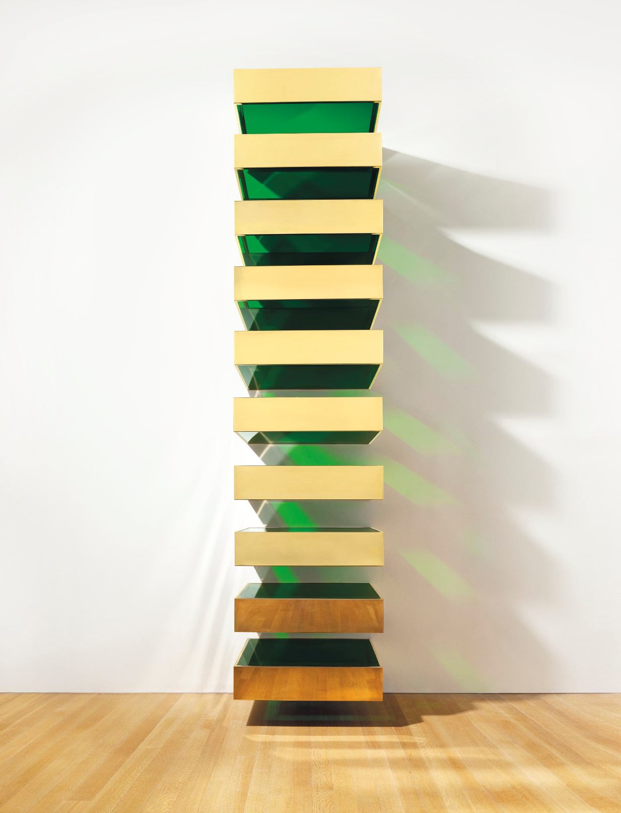 Remembered as a leader of Minimalism and one of the most important figures in post-war American art, Donald Judd began his career as a painter and art critic. In the early 1960s he began to make what he termed “specific objects,”artworks that were neither paintings nor traditional sculptures as they had been previously known. These critical early pieces were often composed of identical three-dimensional units such as rectangles and squares, which he placed on the floor or attached to a wall. Each piece was industrially fabricated based on Judd’s designs –Bernstein Brothers Sheet Metal Specialties, Inc. was his choice firm –and frequently arranged by assistants rather than Judd himself.Untitled, from the artist’s Stacks series, demonstrates Judd’s characteristic simplification of shape, volume, and color in an effort to avoid illusionistic space and reference to the natural world. Judd intended his stacks to activate the viewer’s spatial awareness, blurring the line between three-dimensional sculptures, traditionally visible in the round, and two-dimensional paintings attached to a wall. Judd used this method throughout his career, urging viewers to consider sculpture and environment as an integrated whole. As he explained, “Thespace surrounding my work is critical to it: as much thought has gone into the installation as into a piece itself.” Download this study guide.