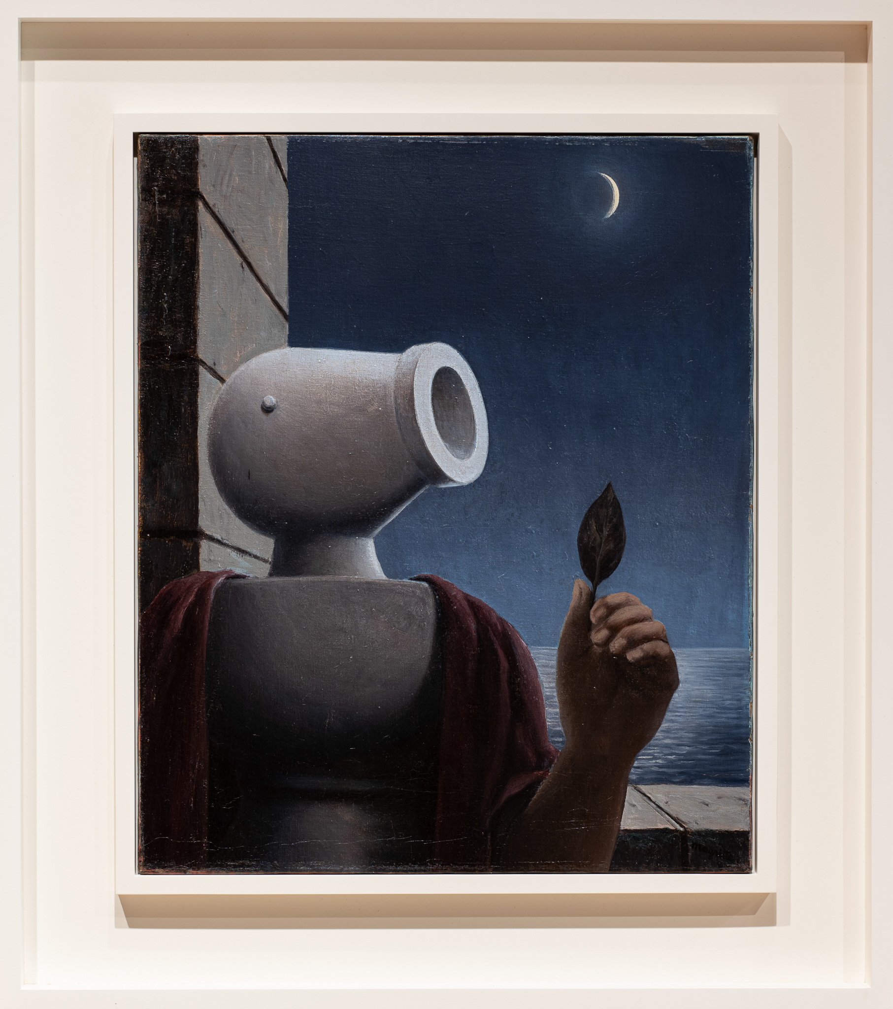 Belgian artist René Magritte was a pivotal member of the international Surrealist movement, celebrated for an oeuvre that intentionally defies interpretation as it questions knowledge, language, and reality. His visually stunning and conceptually complex paintings subvert the ordinary and familiar with unexpected juxtapositions that challenge preconceptions. In LeCicérone, Magritte brings viewers into closer proximity with the subject of an earlier painting, Les Droits de l’homme (1945, “The Rights of Man”; pictured at right; click for larger image). Atop the baluster-like chess piece of a body sits a bilboquet, a simple toy comprised of a wooden cup with a ball attached by a string, which in Magritte’s rendition bears an uncanny resemblance to the head of a cannon. The title (referencing the ancient Roman orator, Cicero) is an antiquated term for an educated guide who gives tours of historical and cultural sites. Placed on an outdoor balcony overlooking a moonlit ocean and gazing at a leaf held by a human hand, the anthropomorphized object appears lost in thought. As is typical for Magritte, the scene is a collection of motifs repeated throughout his career; it serves as a reminder that although knowledge may seem within our grasp, there is little we can truly know with certainty. Download this study guide.
