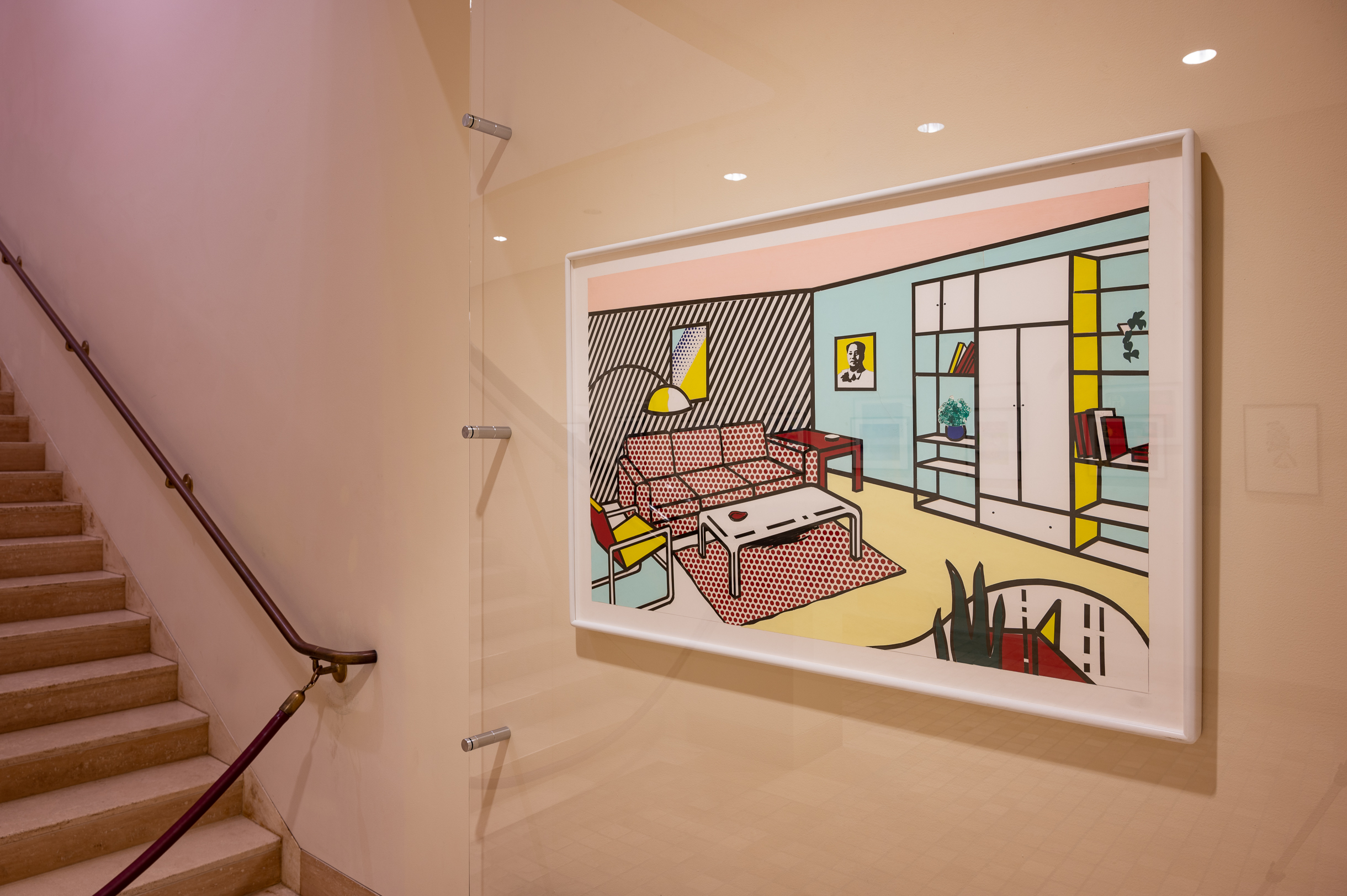 
		As an outstanding example of Pop artist Roy Lichtenstein’s Interior series, Modern Room (Study) takes inspiration from the idealized domestic environments of billboard and phonebook advertisements. The series, painted during the final years of his life, represents a culmination of Lichtenstein’s lifelong fascination with popular culture and the divide between “high” and “low” art. This monumental vision of a generic, middle-class living room features the artist’s distinctive use of primary colors, thick black outlines, and Ben-Day dots – a commercial printing technique prevalent in comic books during the 1950s and 1960s that employs small, colored dots to create dimension and shading. Lichtenstein conflates the visual methods and conventions of “low” artistic mediums such as comic illustration and commercial advertisements with the “high” art of painting, using the motif of a modern domestic interior to comment on the consumerist quest for happiness through the purchase of massproduced goods. The artist offers an additional, possibly ironic critique of capitalist culture by decorating the room with one of fellow Pop artist Andy Warhol’s iconic, and endlessly reproduced, portraits of Chinese communist leader Mao Zedong.
		<a href="images/JSMA Research Guide-Roy Lichtenstein.pdf"
				target="_blank">Download this study guide
	